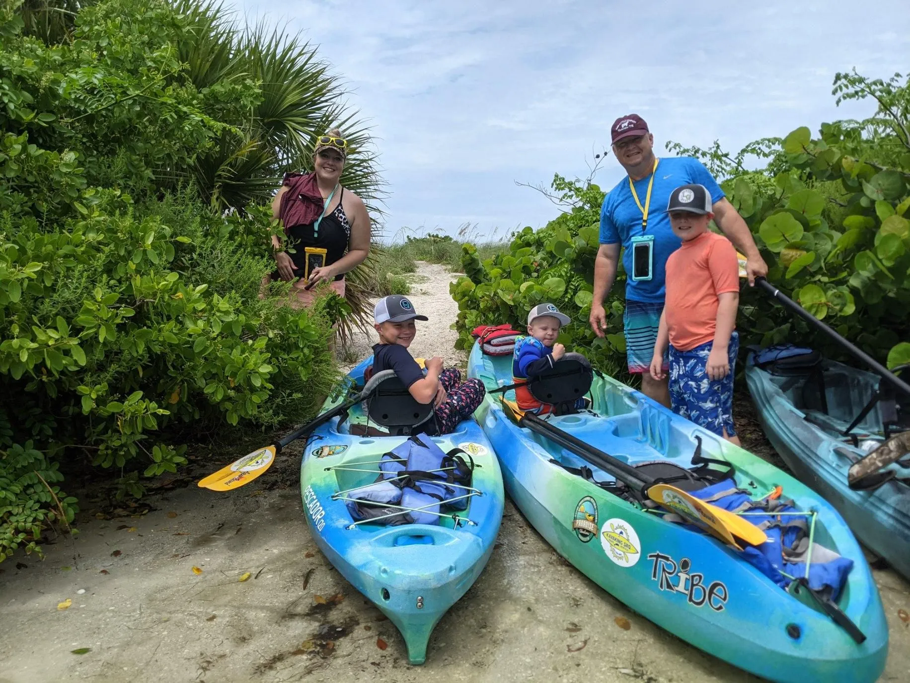 Family enjoying a tandem kayak trip together