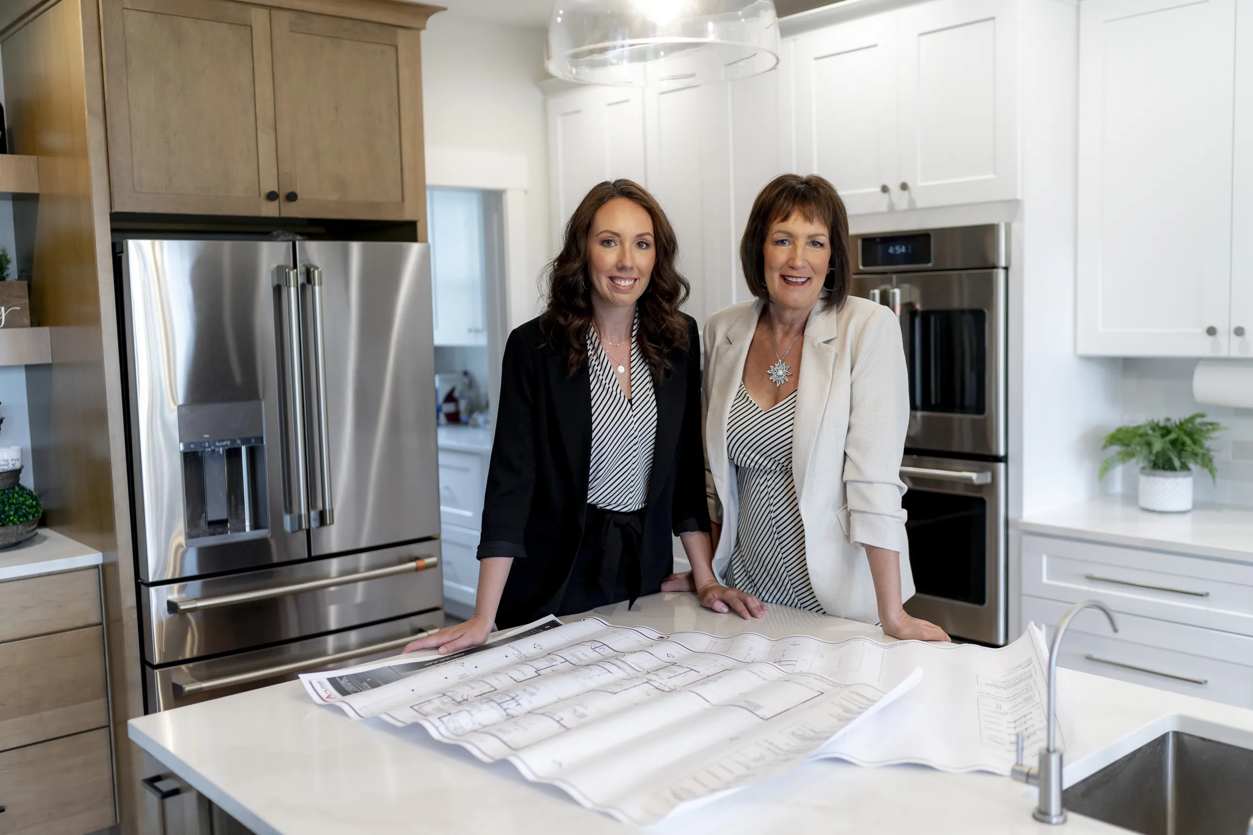 Ashley and Terri standing together in a kitchen